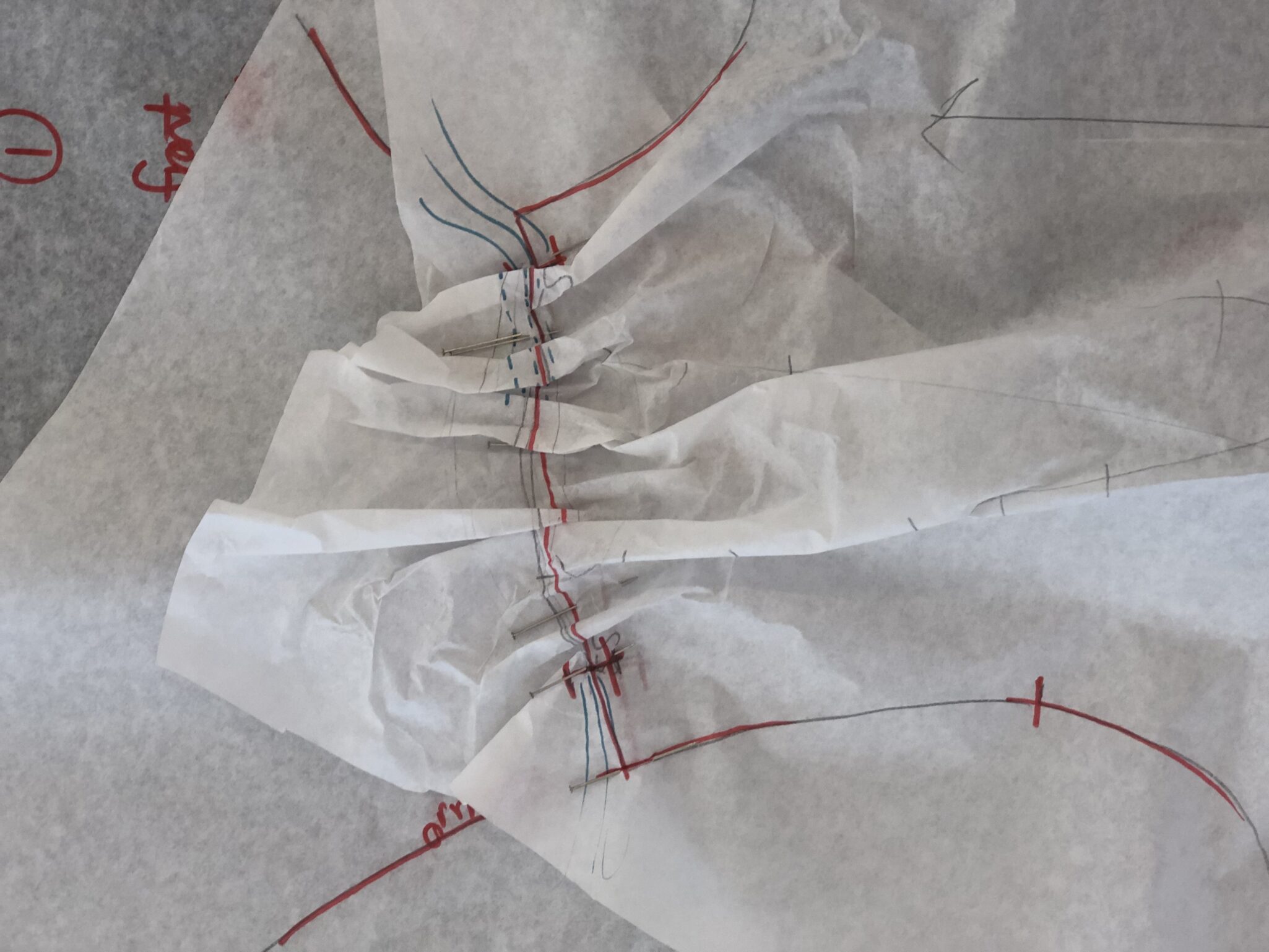 gathers in a flat pattern tissue draft in fashion patternmaking class
